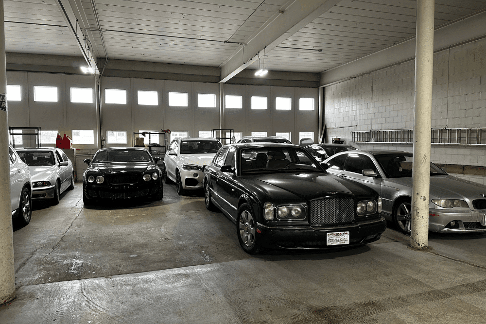 European auto repair in Milwaukee, WI by O'Reilly Motor Cars. Image of multiple luxury European vehicles parked inside the shop, highlighting professional service, detailed inspections, and high-end automotive care.