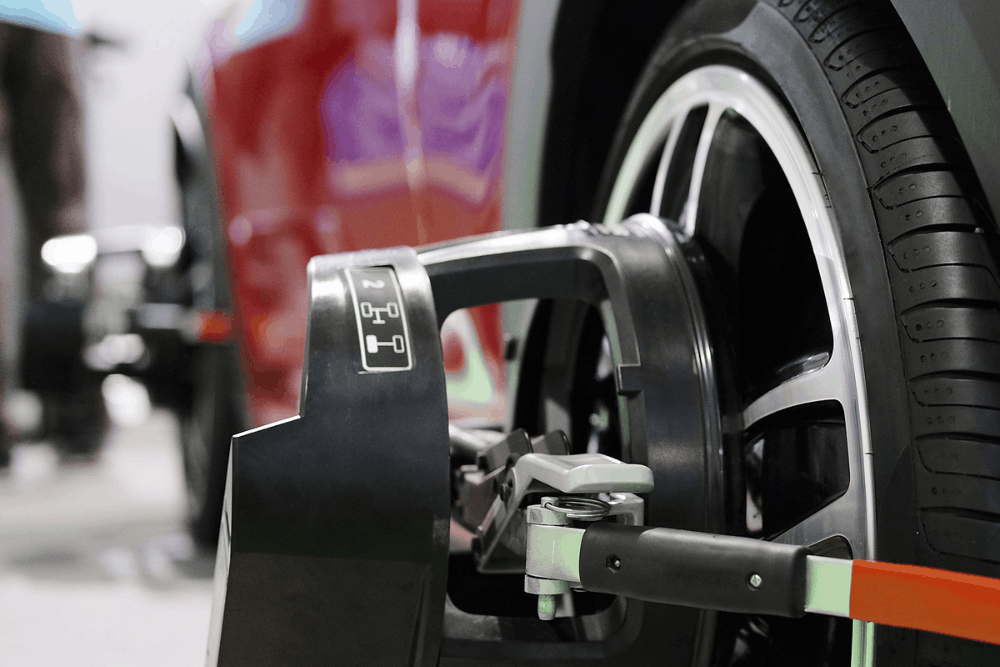 Wheel alignment, auto repair in Milwaukee, WI by O'Reilly Motor Cars. Image of advanced alignment equipment attached to a vehicle wheel, highlighting accurate alignment adjustments, improved handling, extended tire life, and enhanced driving stability.