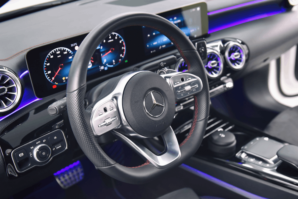 Mercedes electrical issues, auto repair in Milwaukee, WI at O'Reilly Motor Cars. Image of a modern Mercedes-Benz interior featuring the steering wheel, digital dashboard, and center console.