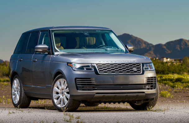 range rover repair, european auto repair in Milwaukee, WI at O'Reilly Motor Cars. A sleek gray Range Rover parked in a scenic outdoor setting with mountains in the background.