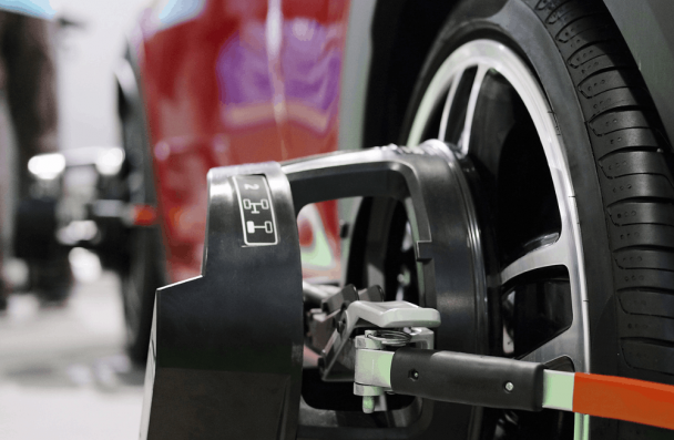 Wheel alignment, auto repair in Milwaukee, WI by O'Reilly Motor Cars. Image of advanced alignment equipment attached to a vehicle wheel, highlighting accurate alignment adjustments, improved handling, extended tire life, and enhanced driving stability.